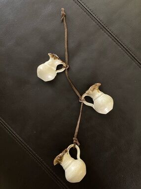 Vintage Handmade Ceramic Mini Pitchers on brown suede tie